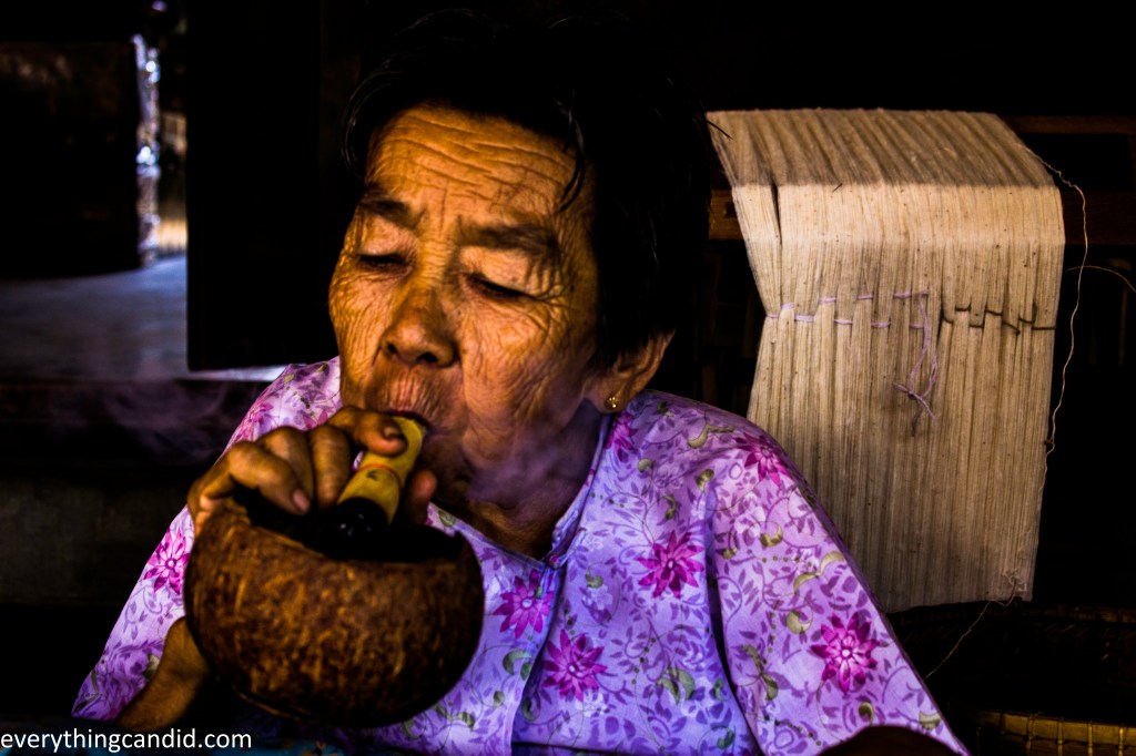 Tribal Woman of Burma smoking Cigar.
